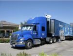 2009 Int'l Pro Star and 2009 Featherlite Double Expando Specialty Semi